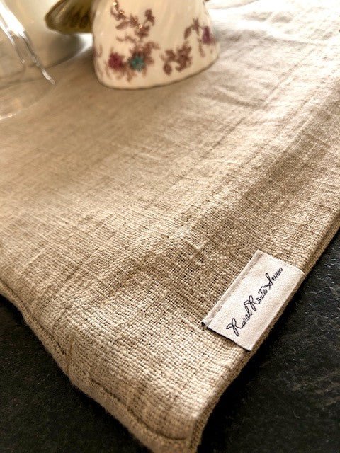 Close up of Made in Canada European Natural Flax Linen & Wool Dish Drying Mat with Rural Route Seven label and tea cup