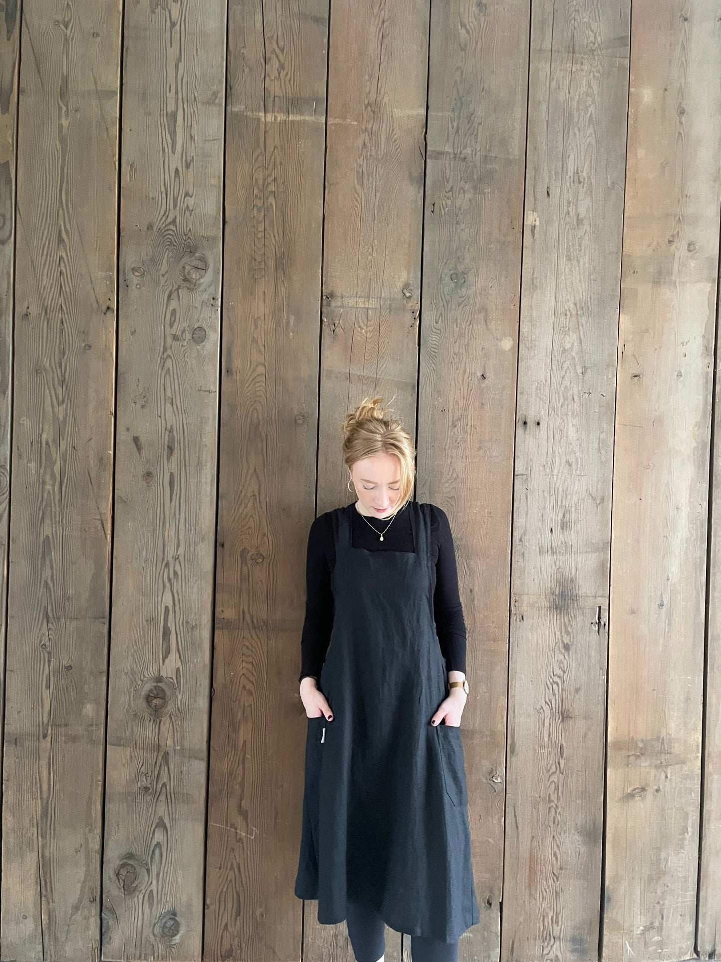 woman wearing black Linen Japanese crossback pinafore apron