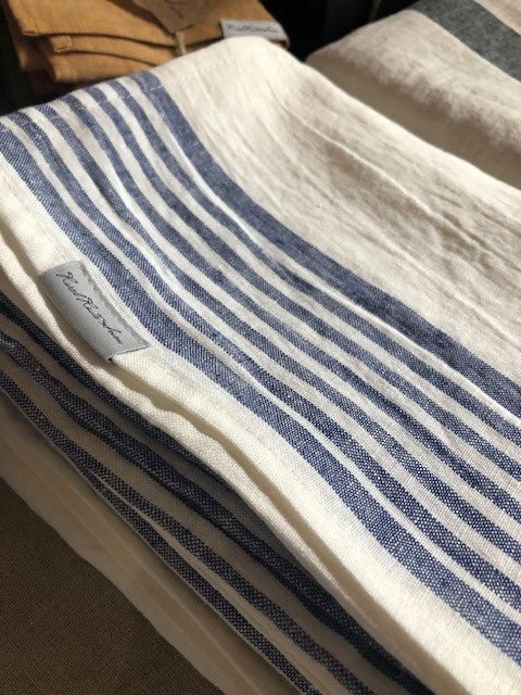 folded white with blue stripes linen huckaback beach towels closeup